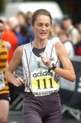 25 October 2004; Irish National Women's Champion and first woman home Valerie Vaughan crosses the line to complete the adidas Dublin City Marathon 2004. Merrion Square, Dublin. Picture credit; Pat Murphy / SPORTSFILE