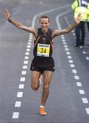 25 October 2004; Pauric McKinney, of Ireland, celebrates coming home as the second Irishman in 13th place and winning silver in the National Marathon Championships. adidas Dublin City Marathon 2004. Merrion Square, Dublin. Picture credit; Brendan Moran / SPORTSFILE
