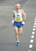 25 October 2004; John Griffin, from Tralee, Co. Kerry, on his way to finishing in 24th place overall and 1st in the Over 45's category. adidas Dublin City Marathon 2004. Merrion Square, Dublin. Picture credit; Brendan Moran / SPORTSFILE