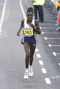 25 October 2004; Florence Barsosio, of Kenya, on her way to finishing second in the Women's race. adidas Dublin City Marathon 2004. Merrion Square, Dublin. Picture credit; Brendan Moran / SPORTSFILE