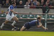 30 October 2004; Denic Hickie, Leinster, goes over for his try despite the attentions of Spencer Davey, Bath. Heineken European Cup 2004-2005, Leinster v Bath, Lansdowne Road, Dublin. Picture credit; Matt Browne / SPORTSFILE