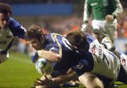 30 October 2004; Gordon D'Arcy, Leinster, scores a try for his side despite the attentions of Michael Lipman, right, and Andrew Higgins, left, Bath. Heineken European Cup 2004-2005, Leinster v Bath, Lansdowne Road, Dublin. Picture credit; Pat Murphy / SPORTSFILE