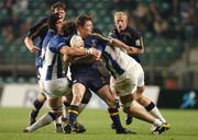 30 October 2004; Brian O'Driscoll, Leinster, is tackled by Rob Fidler, left, and Steve Bortwick, Bath. Heineken European Cup 2004-2005, Leinster v Bath, Lansdowne Road, Dublin. Picture credit; Pat Murphy / SPORTSFILE