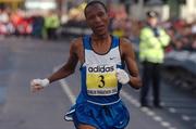25 October 2004; Tseko Mpolokeng, South Africa, crosses the line to finish second in the adidas Dublin City Marathon 2004. Merrion Square, Dublin. Picture credit; Pat Murphy / SPORTSFILE