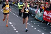25 October 2004; Tatiana Titova, Russia, crosses the line to finish second in the adidas Dublin City Marathon 2004 Women's Race. Merrion Square, Dublin. Picture credit; Pat Murphy / SPORTSFILE