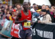 25 October 2004; Julius Kimtai, Kenya, crosses the line to finish third in the adidas Dublin City Marathon 2004. Merrion Square, Dublin. Picture credit; Pat Murphy / SPORTSFILE