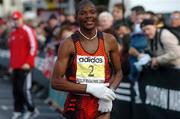 25 October 2004; Zacharia Mpolokeng, South Africa, crosses the line to finish fifth in the adidas Dublin City Marathon 2004. Merrion Square, Dublin. Picture credit; Pat Murphy / SPORTSFILE