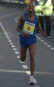 25 October 2004; Benedict Ako, Tanzania, crosses the line to finish ninth in the adidas Dublin City Marathon 2004. Merrion Square, Dublin. Picture credit; Pat Murphy / SPORTSFILE