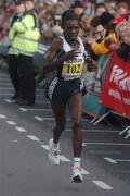 25 October 2004; Florence Barsosio, Kenya, crosses the line to finish second in the adidas Dublin City Marathon 2004 Women's Race. Merrion Square, Dublin. Picture credit; Pat Murphy / SPORTSFILE