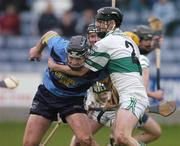 31 October 2004; Bryan Phelan, UCD, in action against Brian Mulligan, Portlaoise. AIB Leinster Club Hurling Championship, Portlaoise v UCD, O'Moore Park, Portlaoise, Co. Laois. Picture credit; Ray McManus / SPORTSFILE
