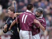 31 October 2004; Athenry players Thomas Kelly and Michael John Quinn (11), celebrate with manager Billy Caulfield after victory over Portumna. Galway County Senior Hurling Final, Portumna v Athenry, Pearse Stadium, Galway. Picture credit; Damien Eagers / SPORTSFILE