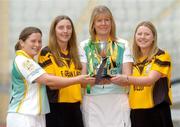 1 November 2004; Anne Morgan, Liatroim Fontenoy, Down, left, Cait Kenny, Four Roads, Roscommon, second from left, Nuala Magee, Liatroim Fontenoy, Down, second from right and Niamh O'Brien, Four Roads, Roscommon, with the Phil McBride Cup at a photocall ahead of the junior camogie Club Final between Four Roads, Roscommon and Liatroim Fontenoy, Down. Croke Park, Dublin. Picture credit; Ciara Lyster / SPORTSFILE