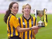 1 November 2004; Imelda Kennedy, left and team-mate Gillian Dillon Maher from St. Lachtain's of Freshford, Kilkenny, with the Bill Carroll Cup at a photocall ahead of the senior camogie Club Final between Granagh-Ballingarry, Limerick and St. Lachtain's of Freshford, Kilkenny. Croke Park, Dublin. Picture credit; Damien Eagers / SPORTSFILE