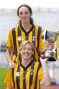 1 November 2004; Imelda Kennedy, back, and Gillian Dillon Maher from St. Lachtain's of Freshford, Kilkenny with the Bill Carroll Cup at a photocall ahead of the senior camogie Club Final between Granagh-Ballingarry, Limerick and St. Lachtain's of Freshford, Kilkenny. Croke Park, Dublin. Picture credit; Damien Eagers / SPORTSFILE