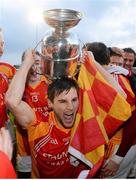 27 October 2013; Castlebar Mitchels captain Donal Newcombe celebrates with the Moclair Cup. Mayo County Senior Club Football Championship Final, Castlebar Mitchels v Breaffy, Elverys MacHale Park, Castlebar, Co. Mayo. Picture credit: David Maher / SPORTSFILE