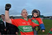 27 October 2013; Tommy Gill, Rathnew, celebrates with his 15 month old son Luke. Wicklow County Senior Club Football Championship Final, Baltinglass v Rathnew, County Grounds, Aughrim, Co. Wicklow. Picture credit: Matt Browne / SPORTSFILE