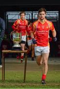 27 October 2013; Castlebar Mitchels captain Donal Newcombe, runs past the Moclair Cup, as he leads his side out for the start of the game. Mayo County Senior Club Football Championship Final, Castlebar Mitchels v Breaffy, Elverys MacHale Park, Castlebar, Co. Mayo. Picture credit: David Maher / SPORTSFILE