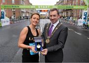 28 October 2013; Lavina McCarron, originally from Meath, now living in Carlow, was awarded the Lord Mayors Medal by Dublin’s Lord Mayor Oisin Quinn, at the beginning of the Airtricity Dublin Marathon. Lavina was diagnosed with breast cancer exactly two years ago today and since finishing treatment has developed a love of running which has helped her through her recovery. Lavina was nominated for this year’s medal by her five closest friends and has inspired them all to run with her today in their first marathon. Fitzwilliam Place, Dublin. Picture credit: Stephen McCarthy / SPORTSFILE