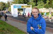 28 October 2013; Kerry footballer Colm Cooper surprised marathon runners today when he linked up with Lucozade Sport at the “Wall of Support” at the Airtricity Dublin Marathon. The Wall was located at the 20th mile at Roebuck Road, designed to help people through the infamous ‘wall’. The Wall of Support carried good luck messages from friends and family of people taking part in the marathon and Colm Cooper came along to hand out some much needed Lucozade Sport and to show his support for the thousands of runners, joggers and walkers. Pictured is Kerry footballer Colm Cooper during the Airtricity Dublin Marathon 2013. Roebuck Road, Dublin. Picture credit: Ramsey Cardy / SPORTSFILE