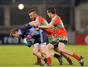 28 October 2013; Rob Finnegan of St. Jude's in action against Ted Furman, left, and Fiach Andrews of Ballymun Kickhams during the Dublin County Senior Club Football Championship semi-final match between Ballymun Kickhams and St Jude's at Parnell Park, Dublin. Photo by Dáire Brennan/Sportsfile