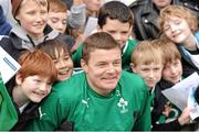 29 October 2013; Brian O'Driscoll poses for a photograph with supporters following an Ireland Open Training Session ahead of their Guinness Series International game against Samoa, on Saturday 9 November. Aviva Stadium, Lansdowne Road, Dublin. Picture credit: Stephen McCarthy / SPORTSFILE