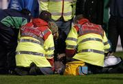 5 November 2004; Former Shamrock Rovers goalkeeper Pat Dunne lies on the pitch being attended to by nurse Asley Fedan and medical staff before the start of the game. eircom league, Premier Division, Shamrock Rovers v Bohemians, Tolka Park, Dublin. Picture credit; David Maher / SPORTSFILE