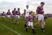 31 October 2004; Athenry captain Eugene Cloonan leads his team during the pre match parade. Galway County Senior Hurling Final, Portumna v Athenry, Pearse Stadium, Galway. Picture credit; Damien Eagers / SPORTSFILE