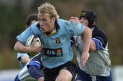 6 November 2004; Eoghan Hickey, UCD, is tackled by John Moloney, Cork Constitution. AIB All-Ireland League 2004-2005, UCD v Cork Constitution, Belfield, Dublin. Picture credit; Damien Eagers / SPORTSFILE