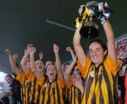7 November 2004; Imelda Kennedy, St. Lachtains Freshford, lifts the cup after victory in the final. All-Ireland Senior Camogie Club Final, Granagh-Ballingarry v St. Lachtains Freshford, Parnell Park, Dublin. Picture credit; Brian Lawless / SPORTSFILE