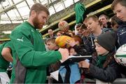 29 October 2013; Ireland's Gordon D'Arcy sign an autographs for Patrick O'Brien, age 7, from Rathgar, Dublin, following an Ireland Open Training Session ahead of their Guinness Series International game against Samoa, on Saturday 9 November. Aviva Stadium, Lansdowne Road, Dublin. Picture credit: Stephen McCarthy / SPORTSFILE