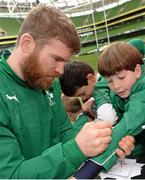 29 October 2013; Ireland's Gordon D'Arcy sign an autographs for Ryan Nolan, age 8, from Monkstown, Co. Cork, following an Ireland Open Training Session ahead of their Guinness Series International game against Samoa, on Saturday 9 November. Aviva Stadium, Lansdowne Road, Dublin. Picture credit: Stephen McCarthy / SPORTSFILE
