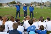 30 October 2013; Leinster Academy players, from left, Jordan Coghlan, Edward Byrne and Sam Coghlan Murray speaking to participants at a Leinster School of Excellence. Leinster School of Excellence on Tour in Railway Union RFC, Dublin. Picture credit: Brendan Moran / SPORTSFILE