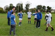 30 October 2013; Leinster Academy players Jordan Coghlan and Sam Coghlan Murray get involved in a game of tip rugby with participants at a Leinster School of Excellence. Leinster School of Excellence on Tour in Railway Union RFC, Dublin. Picture credit: Brendan Moran / SPORTSFILE