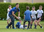 30 October 2013; Leinster Academy player Jordan Coghlan in action alongside participants at a Leinster School of Excellence. Leinster School of Excellence on Tour in Railway Union RFC, Dublin. Picture credit: Brendan Moran / SPORTSFILE