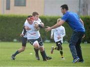 30 October 2013; Participant Darren Magee is tackled by Cillian O'Neill as Leinster Academy player Jordan Coghlan looks on during a Leinster School of Excellence. Leinster School of Excellence on Tour in Railway Union RFC, Dublin. Picture credit: Brendan Moran / SPORTSFILE