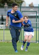 30 October 2013; Leinster Academy player Jordan Coghlan goes through a training drill with participant Joost Peeters at a Leinster School of Excellence. Leinster School of Excellence on Tour in Railway Union RFC, Dublin. Picture credit: Brendan Moran / SPORTSFILE