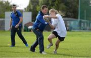 30 October 2013; Participant Sophie Farnan in action against  Leinster Academy player Sam Coghlan Murray a Leinster School of Excellence. Leinster School of Excellence on Tour in Railway Union RFC, Dublin. Picture credit: Brendan Moran / SPORTSFILE