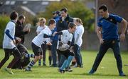 30 October 2013; Participant Dylan Ryan in action against Leinster Academy player Jordan Coghlan at a Leinster School of Excellence. Leinster School of Excellence on Tour in Railway Union RFC, Dublin. Picture credit: Brendan Moran / SPORTSFILE