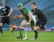 26 October 2013; Cahir Healy, Ireland, in action against Norman Campbell, Scotland. Shinty International First Test, Ireland v Scotland, Croke Park, Dublin. Picture credit: Ray McManus / SPORTSFILE