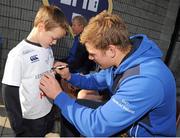 31 October 2013;  Ross McManus has his shirt signed by Jordi Murphy, Leinster at a Leinster School of Excellence on tour in Blackrock College, Blackrock, Co. Dublin. Picture credit: Ramsey Cardy / SPORTSFILE