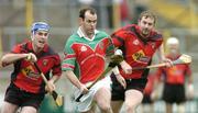 14 November 2004; Brian McEvoy, James Stephens, is tackled by Pierce Redmond and Anthony O'Leary, right, Oulart-The-Ballagh. AIB Leinster Senior Club Hurling Championship Semi Final, James Stephens v Oulart-The-Ballagh, Nowlan Park, Kilkenny. Picture credit; Matt Browne / SPORTSFILE