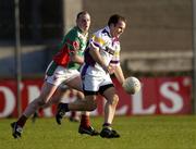 13 November 2004; Mick O'Keeffe, Kilmacud Crokes, in action against Sean O Donnoghue, Garrycastle. AIB Leinster Club Football Championship, Quarter-Final, Kilmacud Crokes v Garrycastle, Parnell Park, Dublin. Picture credit; Brian Lawless / SPORTSFILE