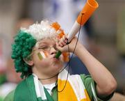 17 October 2004; Young Irish fan Muiris Bartley cheers on his side during the game. Coca Cola International Rules Series 2004, First Test, Ireland v Australia, Croke Park, Dublin. Picture credit; Brian Lawless / SPORTSFILE *** Local Caption *** Any photograph taken by SPORTSFILE during, or in connection with, the 2004 Coca Cola International Rules Series which displays GAA logos or contains an image or part of an image of any GAA intellectual property, or, which contains images of a GAA player/players in their playing uniforms, may only be used for editorial and non-advertising purposes.  Use of photographs for advertising, as posters or for purchase separately is strictly prohibited unless prior written approval has been obtained from the Gaelic Athletic Association.