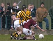 14 November 2004; Oisin McConville, Crossmaglen Rangers, is tackled by Francis McEldowney and Patsy Bradley (9), Slaughtneil, which resulted in a penalty. AIB Ulster Senior Club Football Championship Quarter Final Replay, Crossmaglen Rangers v Slaughtneil, Oliver Plunkett Park, Crossmaglen, Co. Armagh. Picture credit; Brendan Moran / SPORTSFILE