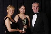 20 November 2004; Catriona McConnell of Monaghan receives her Young Ulster Ladies Player of the Year award from An Taoiseach Bertie Ahern TD, and President of the Ladies Football Association Geraldine Giles at the O'Neills / TG4 Ladies Football All-Stars. Citywest, Dublin. Picture credit; Brendan Moran / SPORTSFILE
