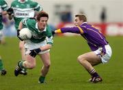 21 November 2004; Peter McNulty, Portlaoise, is tackled by Paul Griffin, Kilmacud Crokes. AIB Leinster Club Senior Football Championship Semi-Final, Portlaoise v Kilmacud Crokes, Dr. Cullen Park, Portlaoise, Co. Laois. Picture credit; Matt Browne / SPORTSFILE