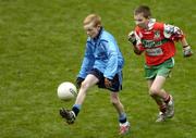 22 November 2004; Glenn Lockhart, St. Peter and Paul NS, Baldoyle, races clear of  Raymond Wood, Our Lady of Victory NS, Ballymun. Corn Mhic Chaoilte Allianz Cumann na mBunscol Football Final, St. Peter and Paul NS, Baldoyle v Our Lady of Victory NS, Ballymun, Croke Park, Dublin. Picture credit; Damien Eagers / SPORTSFILE