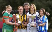 23 November 2004; Opposing captains in the AIB All-Ireland Ladies Club Senior Football Final, Karen Hopkins, right, of Ballyboden St Endas, and Juliet Murphy, 2nd from right, Donaghmore, Cork, with Junior Finalists, Voureen Quigley, left, of Iniskeen, Monaghan and Noreen Fealy, 2nd from left, of Abbeydorney, Kerry, with Billy Finn, AIB, at a photocall ahead of the AIB Ladies Football All-Ireland Club Finals with the Senior and Junior Finals on Sunday next, 28th November, and the Intermediate Final on Sunday 5th December. AIB Bankcentre, Ballsbridge, Dublin. Picture credit; Brendan Moran / SPORTSFILE