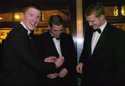 26 November 2004; Niall Gilligan, Clare, left, and Henry Shefflin, Kilkenny, assist Waterford's Ken McGrath in closing his jacket at the 2004 Vodafone GAA All-Star Awards. Citywest, Dublin. Picture credit; Brendan Moran / SPORTSFILE