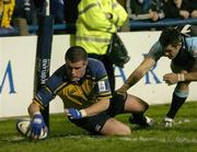 26 November 2004; Shane Jennings, Leinster, goes over for his try despite the intentions of Kenny Logan, Glasgow Rugby. Celtic League 2004-2005, Leinster v Glasgow Rugby, Donnybrook, Dublin. Picture credit; Matt Browne / SPORTSFILE